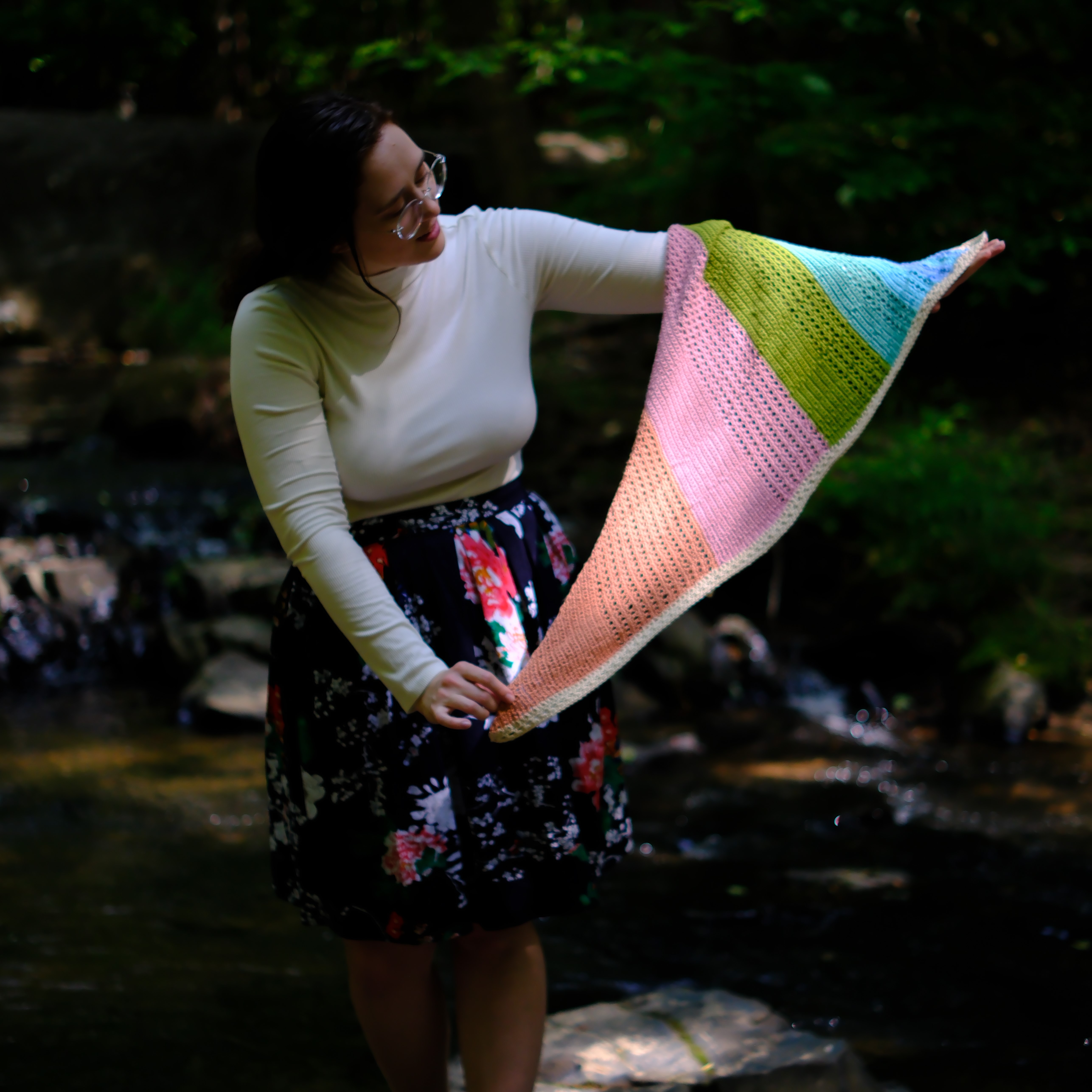 light catching the shawl held aloft