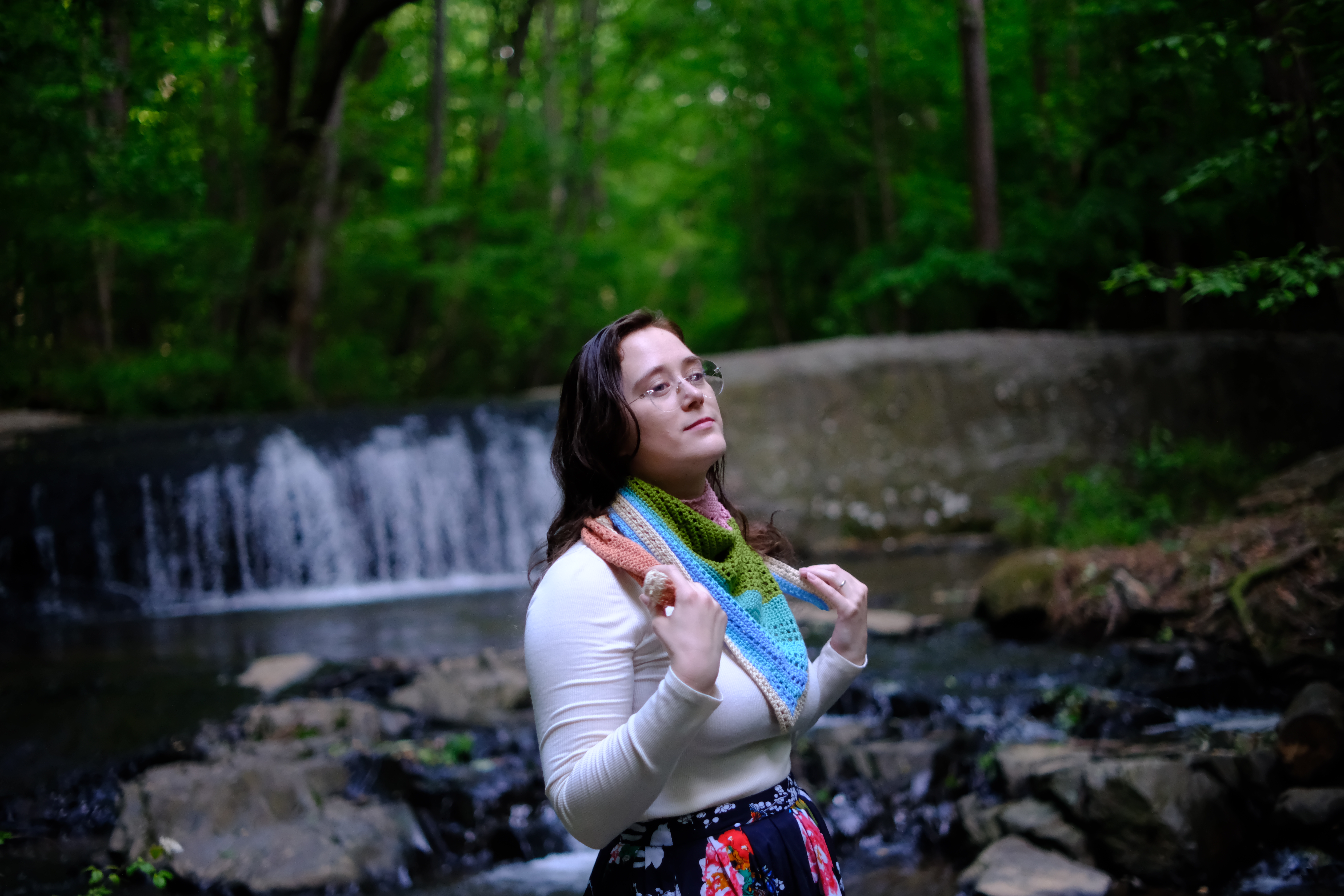 gently holding shawl ends, looking melodramatic