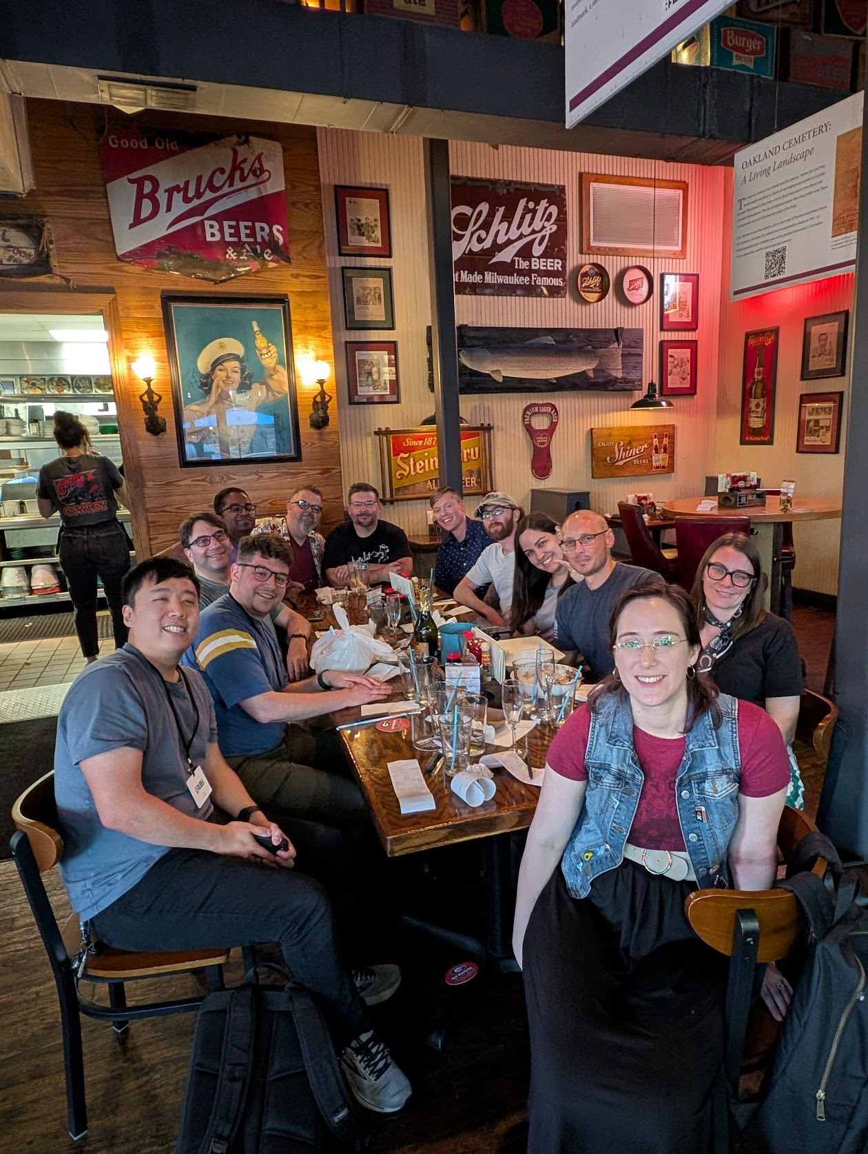 Group photo at dinner - 12 rubyists around a table in a seafood-themed pub